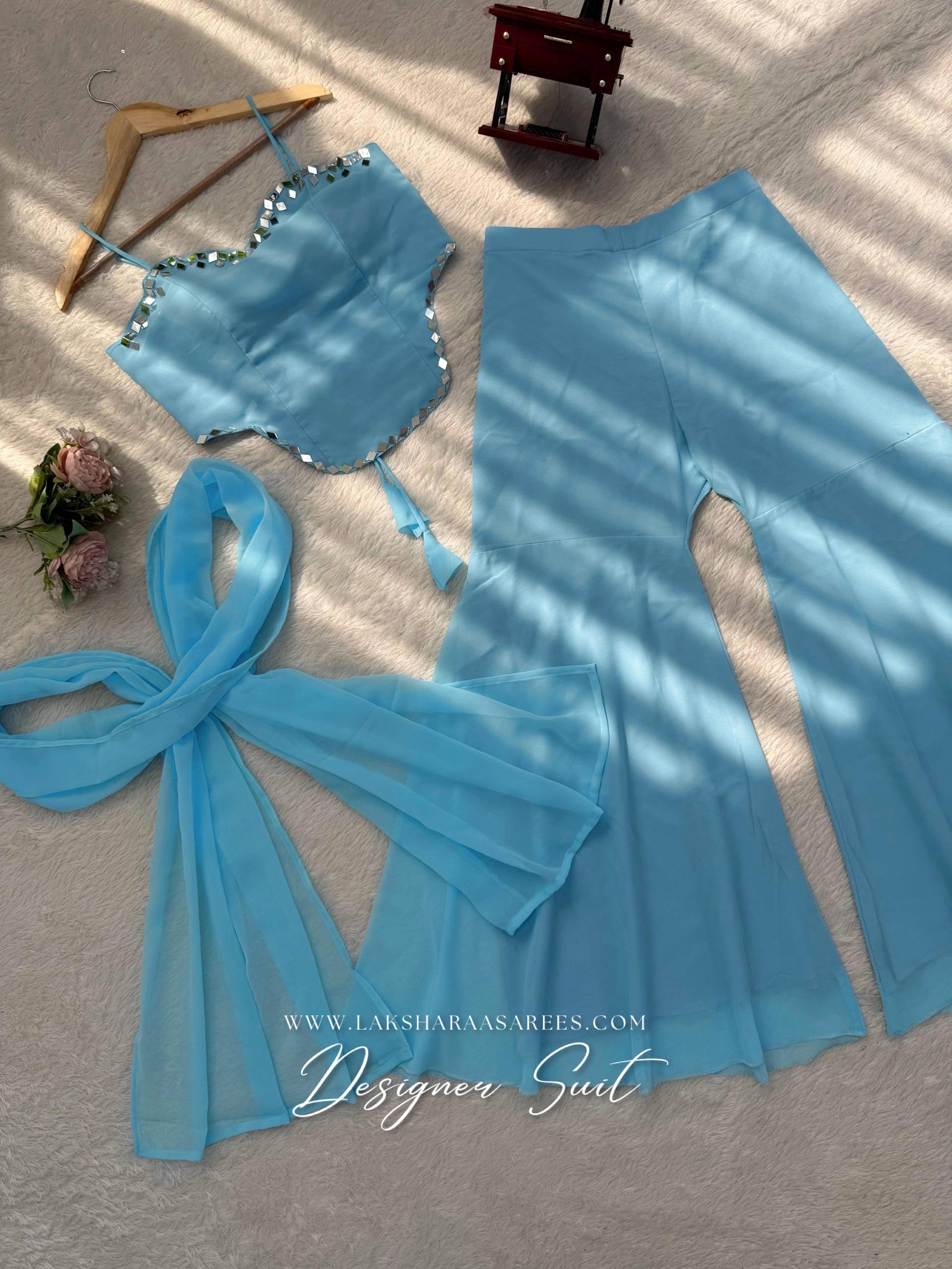 Elegant ISHITA 90s-style georgette corset suit with intricate embroidery, showcased in a detailed Laksharaa Sarees product image.