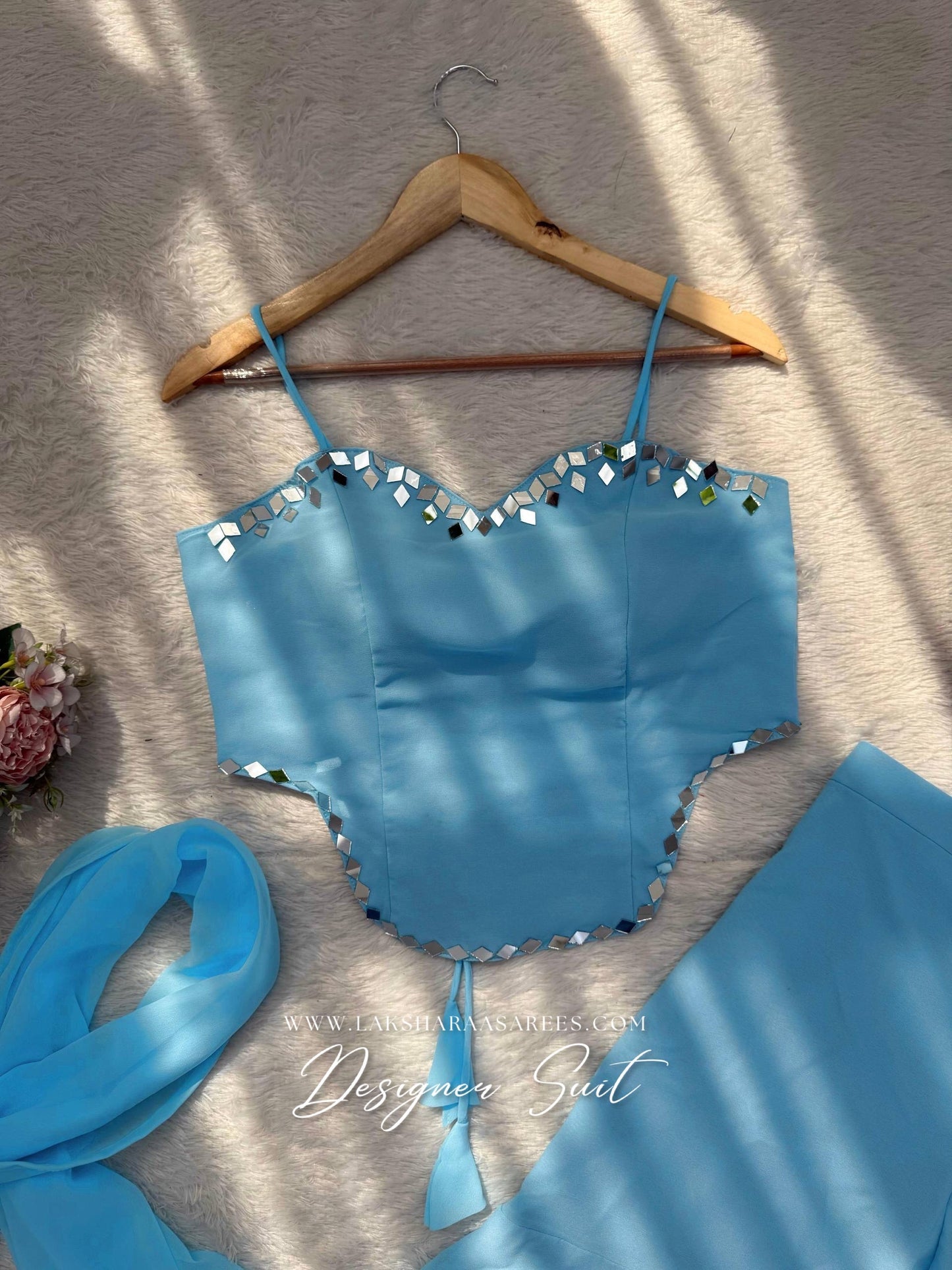 Elegant ISHITA 90s style georgette corset suit featuring intricate detailing, worn by a model showcasing traditional Indian fashion.