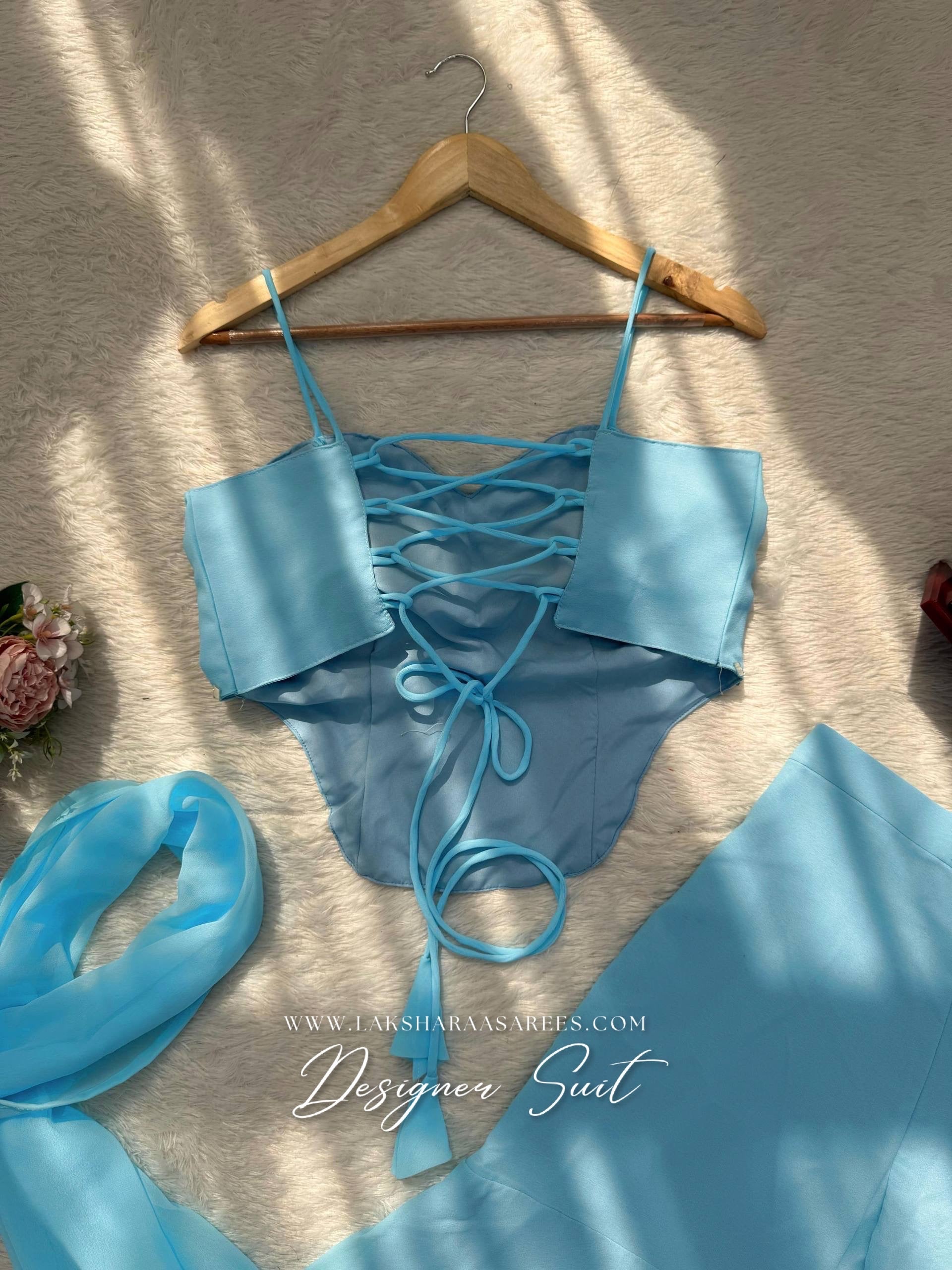 Pink ISHITA 90s style georgette corset suit with intricate embroidery and matching dupatta, designed by Laksharaa Sarees.