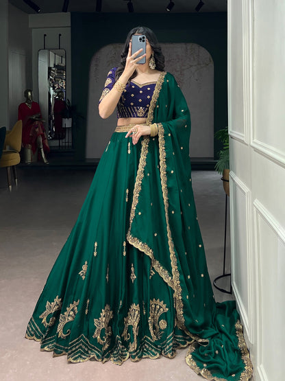 Green and blue Rangoli silk lehenga by Laksharaa Sarees featuring intricate embroidery and traditional design.