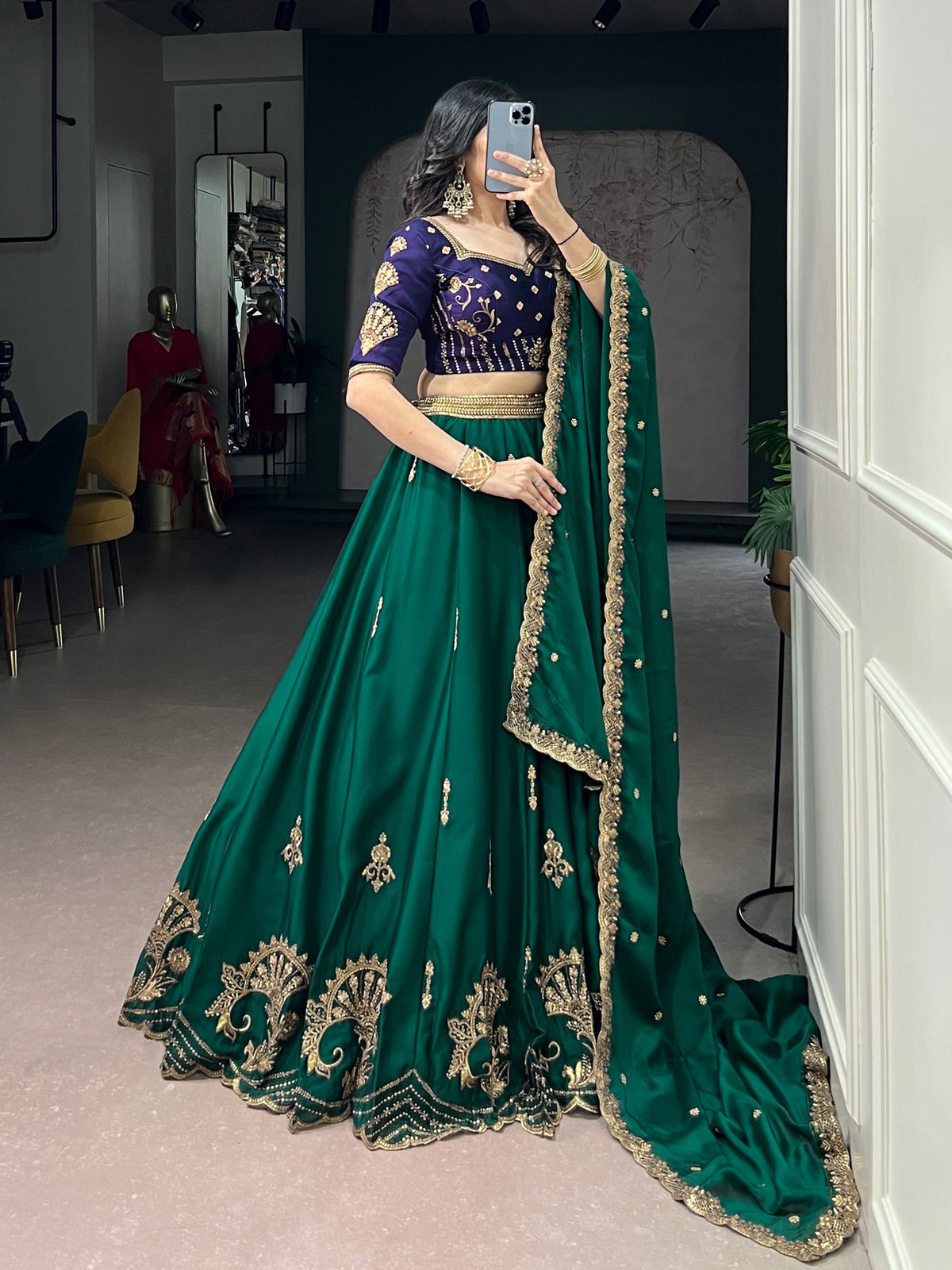 Green and blue Rangoli silk Lehenga by Laksharaa Sarees featuring intricate embroidery and traditional design.