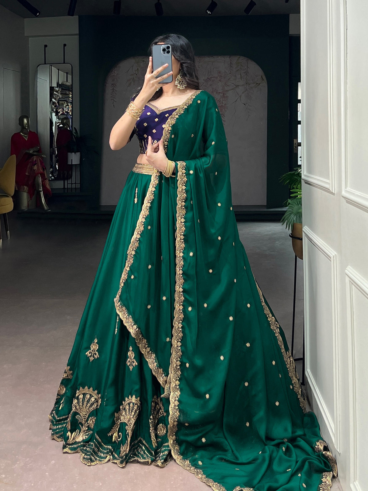 Green and blue Rangoli silk Lehenga by Laksharaa Sarees featuring intricate embroidery and traditional design.