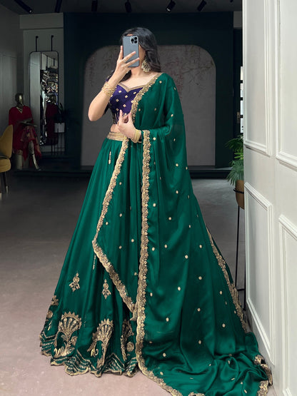 Green and blue Rangoli silk Lehenga by Laksharaa Sarees featuring intricate embroidery and traditional design.