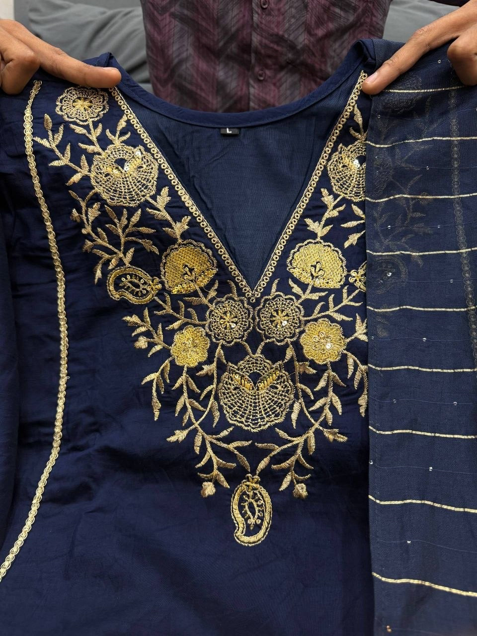 Elegant green Laksharaa Sarees kurti with intricate embroidery and traditional design, displayed on a mannequin.