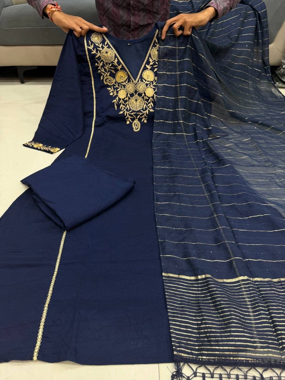 Elegant pink and gold kurti from Laksharaa Sarees featuring intricate embroidery and a classic neckline.