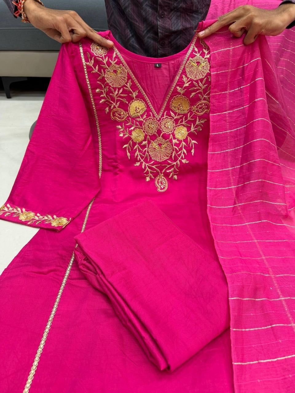 Laksharaa Sarees kurti with intricate embroidery and vibrant colors, showcased on a hanger against a plain background.