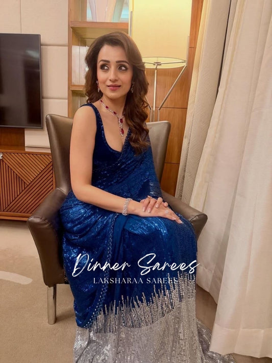 Dark blue partywear saree by Laksharaa Sarees featuring intricate designs and elegant draping for festive occasions.