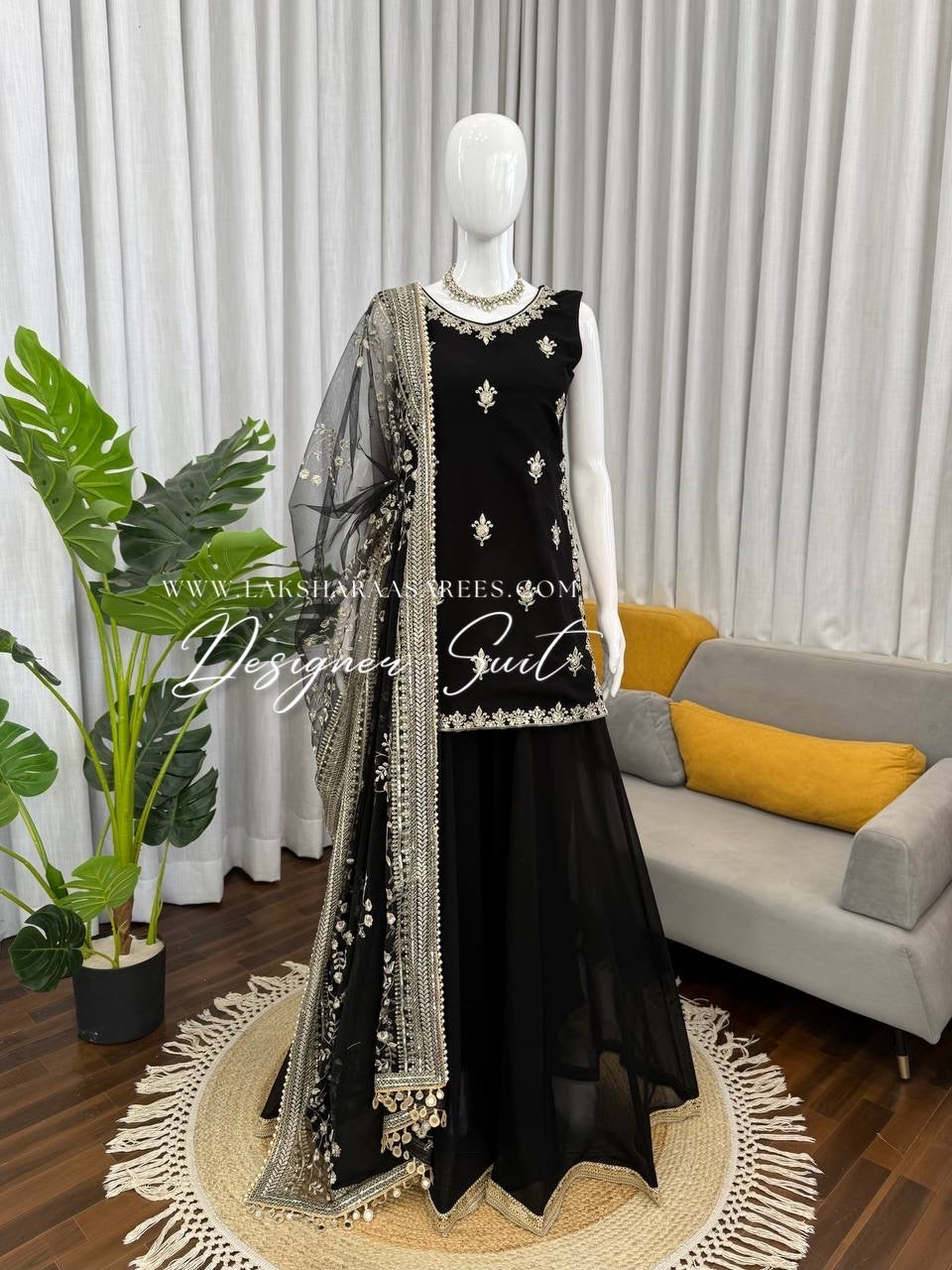 Black georgette palazzo suit from Laksharaa Sarees, featuring flowy fabric and traditional design details.