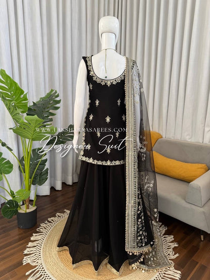 Black Georgette Pallazo Suit from Laksharaa Sarees featuring a flowing top and matching pallazo pants.