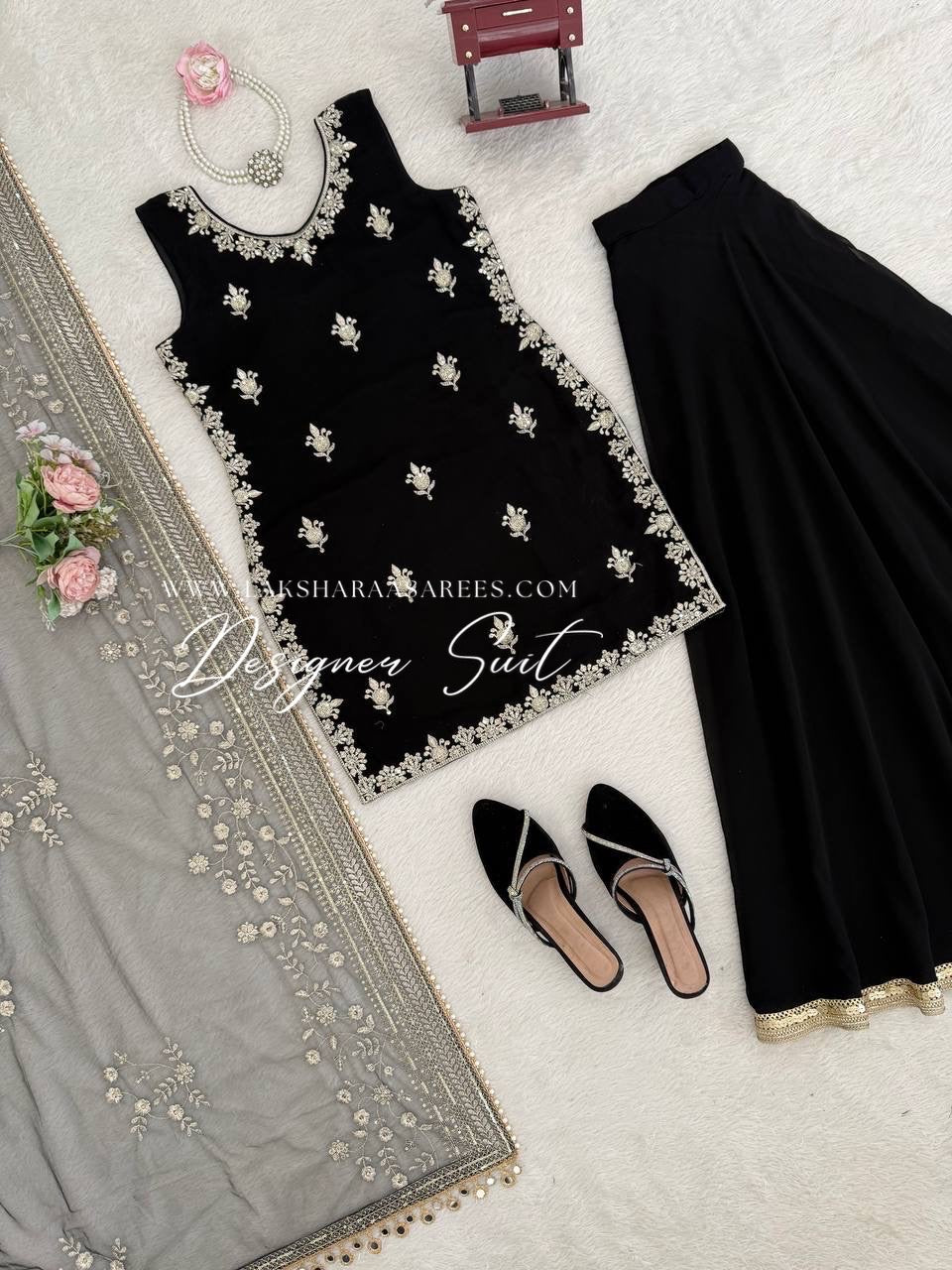 Black Georgette Pallazo Suit from Laksharaa Sarees featuring a flowing silhouette and intricate detailing.