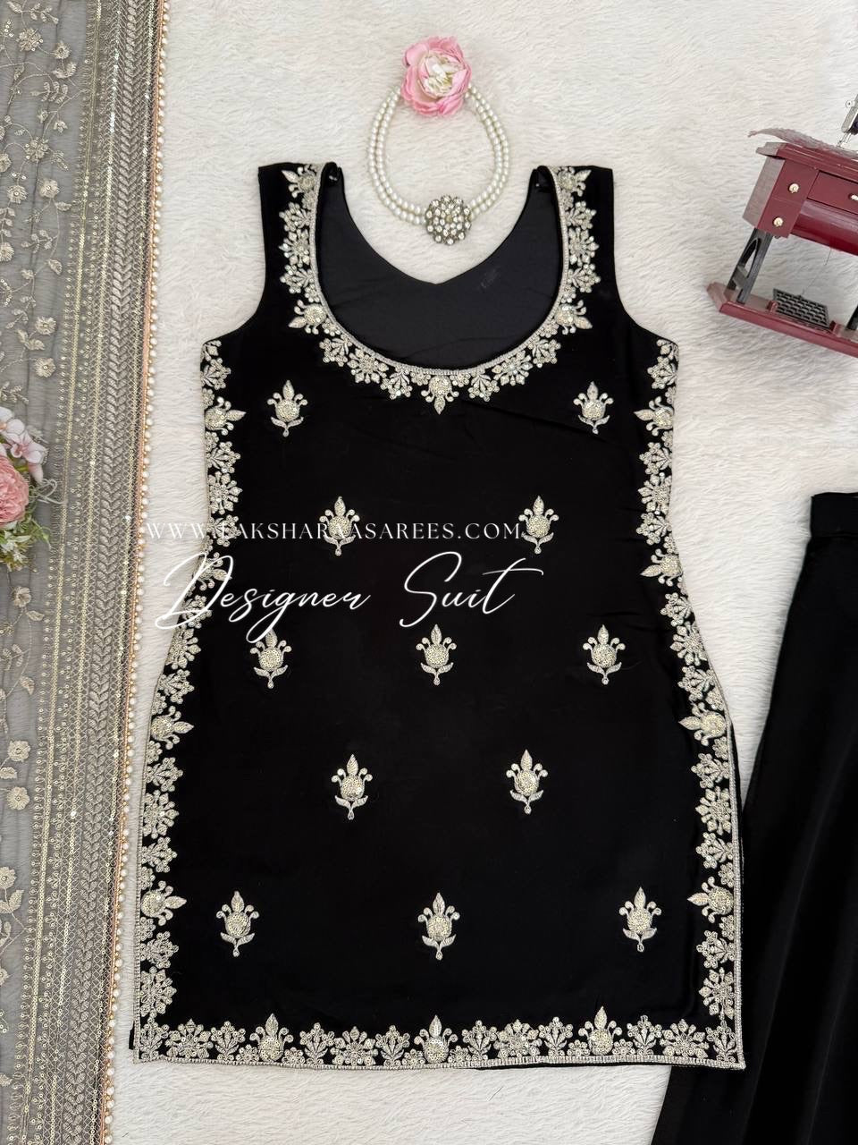 Black georgette palazzo suit from SUHANA collection by Laksharaa Sarees, featuring flowing fabric and elegant design details.