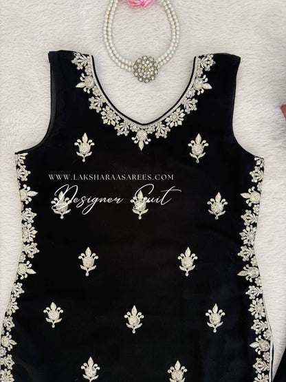 Black georgette palazzo suit from SUHANA by Laksharaa Sarees, featuring flowing fabric and elegant design.