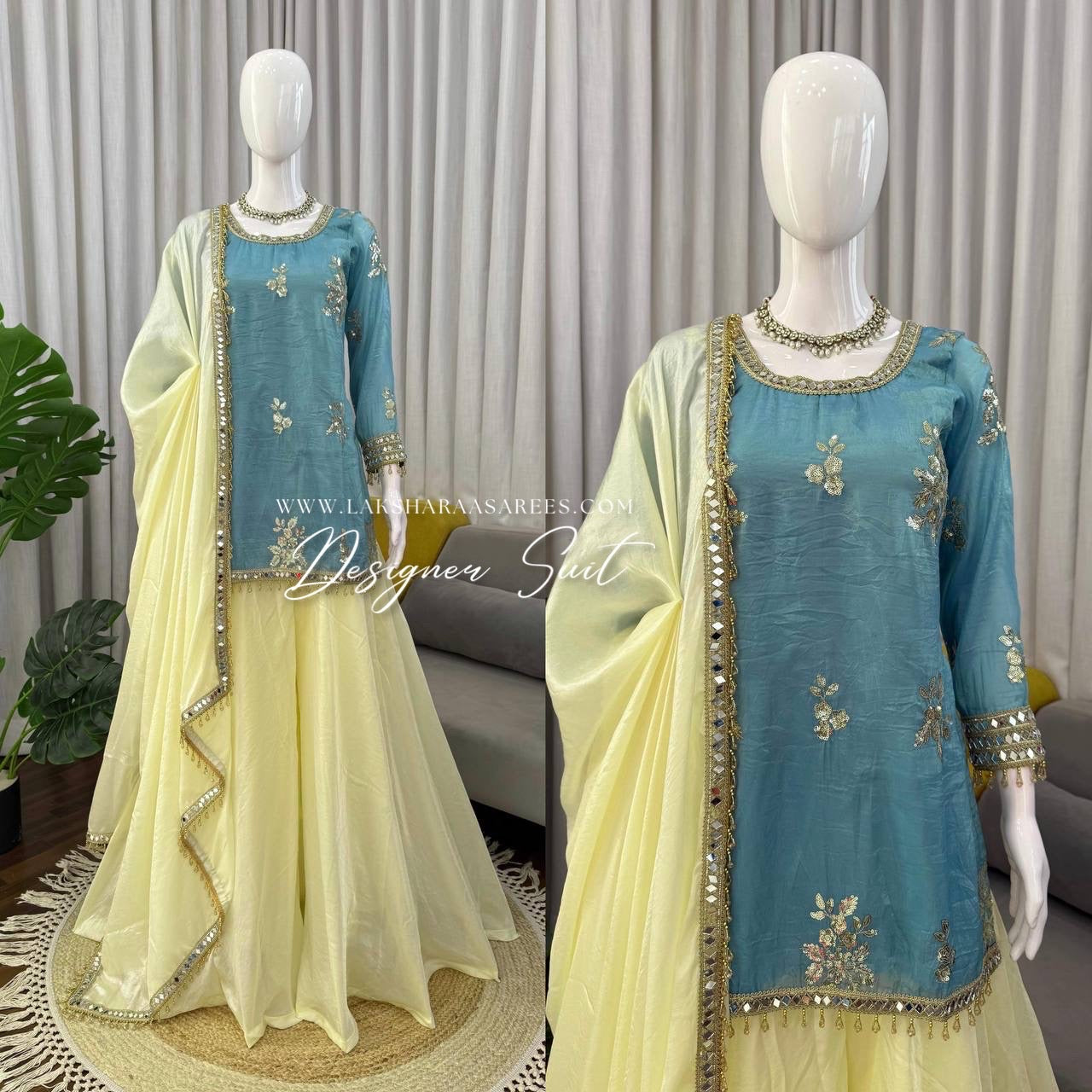 Blue and yellow shimmer silk designer suit by Laksharaa Sarees featuring intricate jasmine-inspired embroidery and elegant draping.