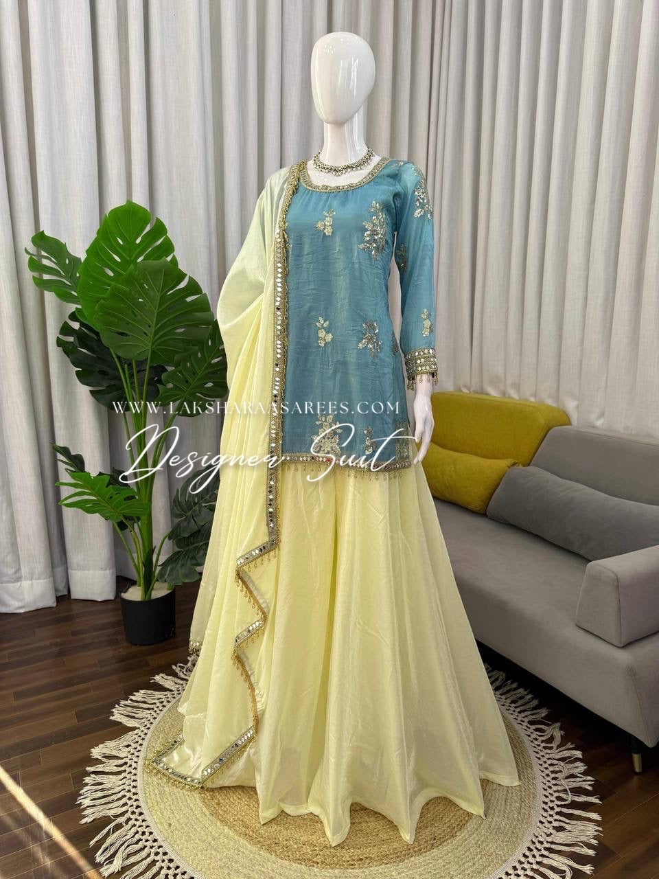 Blue and yellow shimmer silk designer suit with intricate detailing, featuring Jasmine brand Laksharaa Sarees.