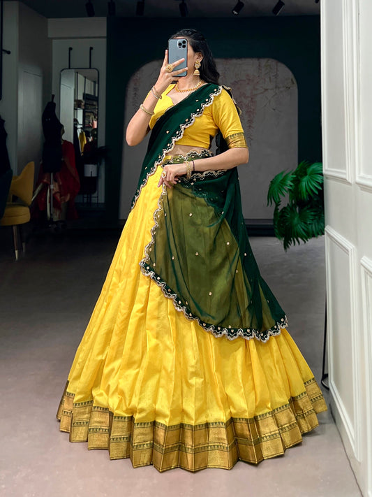 Cotton silk half saree lehenga by Laksharaa Sarees featuring intricate embroidery and vibrant colors.