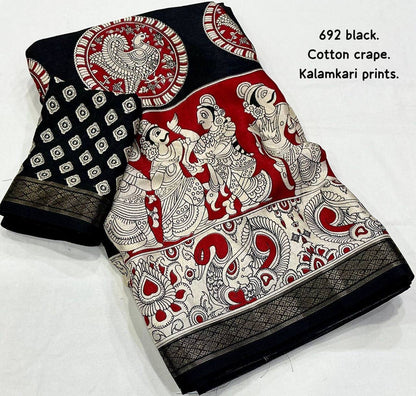 Black and red soft cotton crepe Kalamkari saree with intricate hand-painted designs, styled with traditional draping.