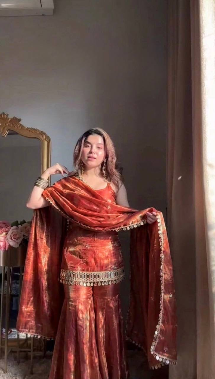 Shimmer silk Sharara set with intricate embroidery, featuring a matching kurta and flared pants from Laksharaa Sarees.