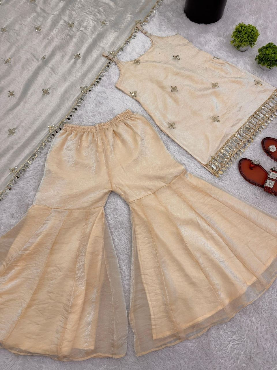 Shimmer silk Sharara set featuring intricate embroidery and flowing fabric, designed by Laksharaa Sarees for elegant traditional wear.