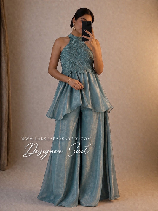 Shimmer silk halter top designer suit with matching palazzo pants by Laksharaa Sarees, featuring elegant fabric and intricate detailing.