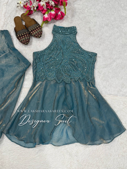 Shimmer silk halter top designer suit with matching palazzo pants by Laksharaa Sarees, showcasing intricate embroidery and elegant fabric.