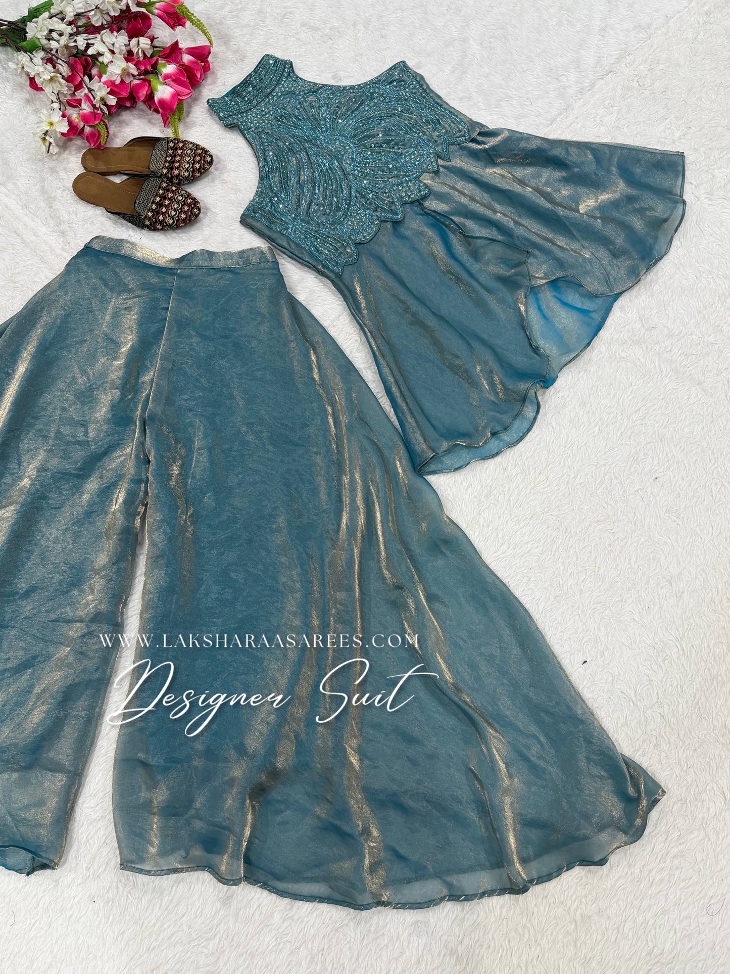 Shimmer silk halter top designer suit with matching palazzo pants by Laksharaa Sarees, featuring intricate embroidery and elegant design.