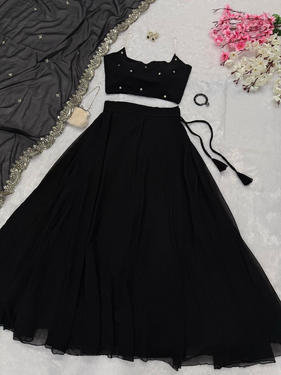 Beaded strap blouse with intricate detailing paired with a vibrant readymade lehenga from Laksharaa Sarees.