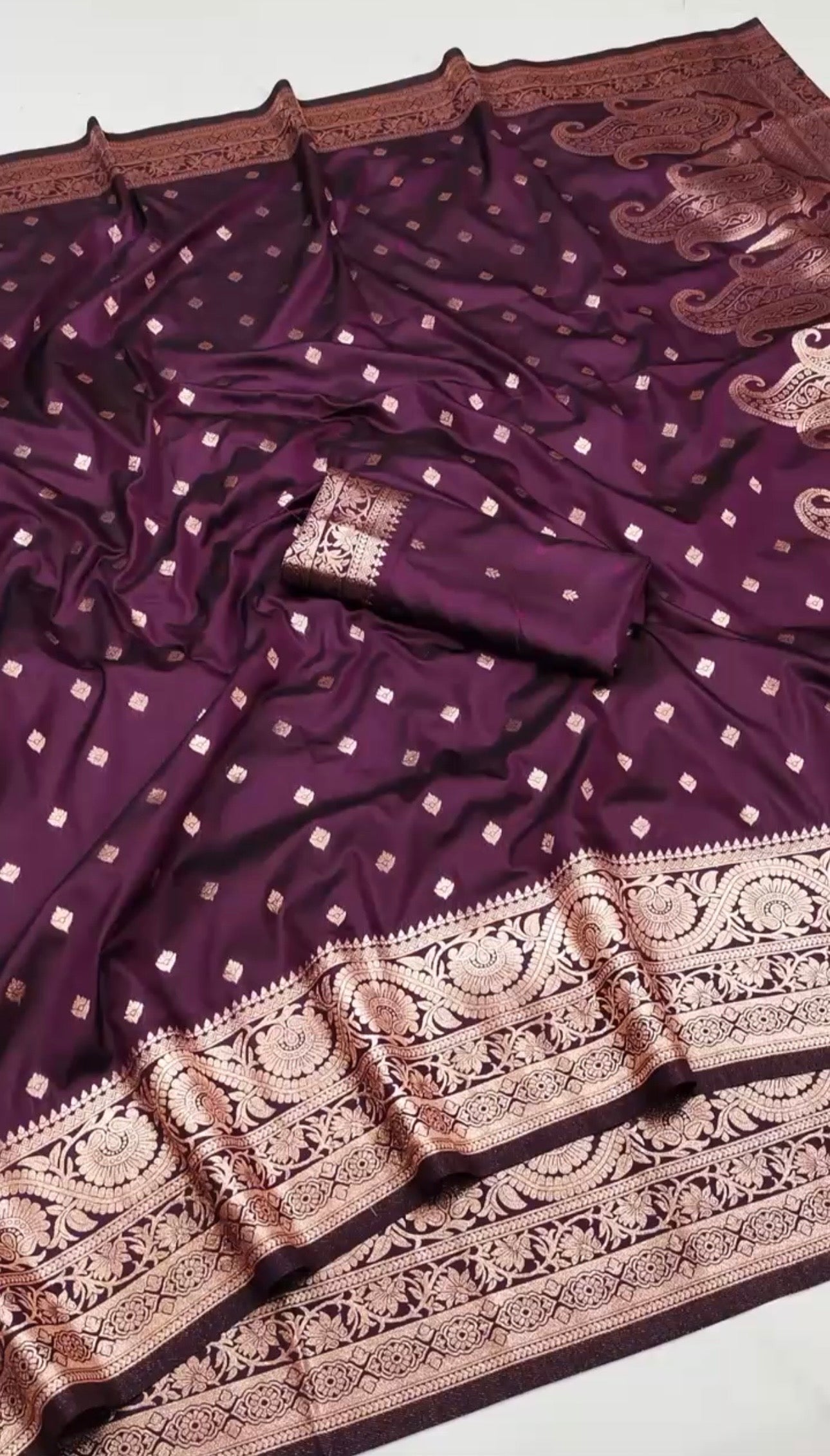 Elegant dual-toned Nilaa Banarasi soft silk saree with intricate gold zari work and rich traditional design.