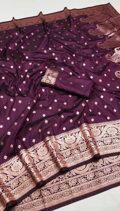 Elegant dual-toned Nilaa Banarasi soft silk saree with intricate gold zari work and rich traditional design.