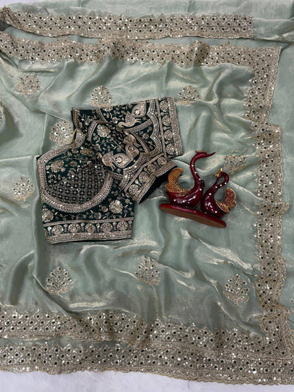 Elegant shimmer saree by Laksharaa Sarees with a matching readymade blouse, featuring intricate detailing and luxurious fabric.