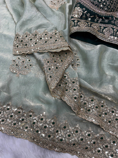 Luxurious shimmer saree with matching readymade blouse by Laksharaa Sarees, featuring intricate details and elegant drape.