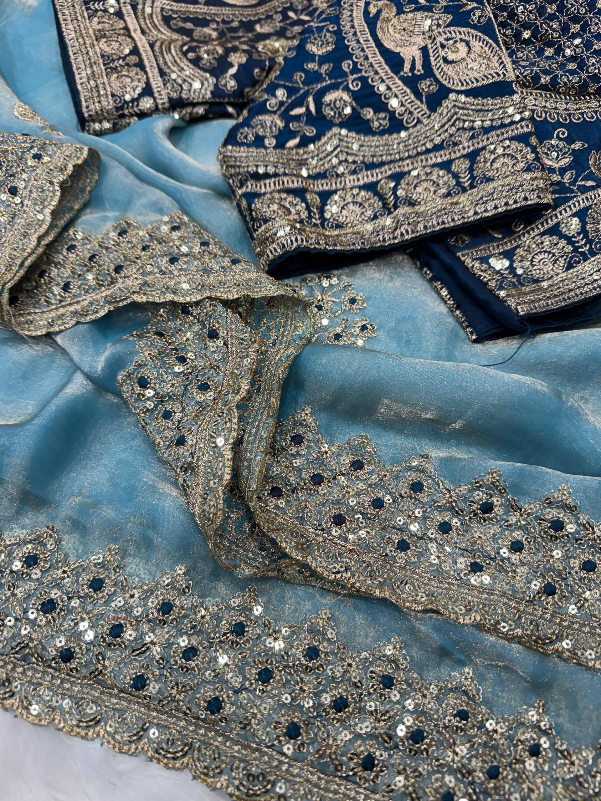 Laksharaa Sarees JESSIA premium shimmer saree with matching readymade blouse, featuring elegant fabric and intricate design details.
