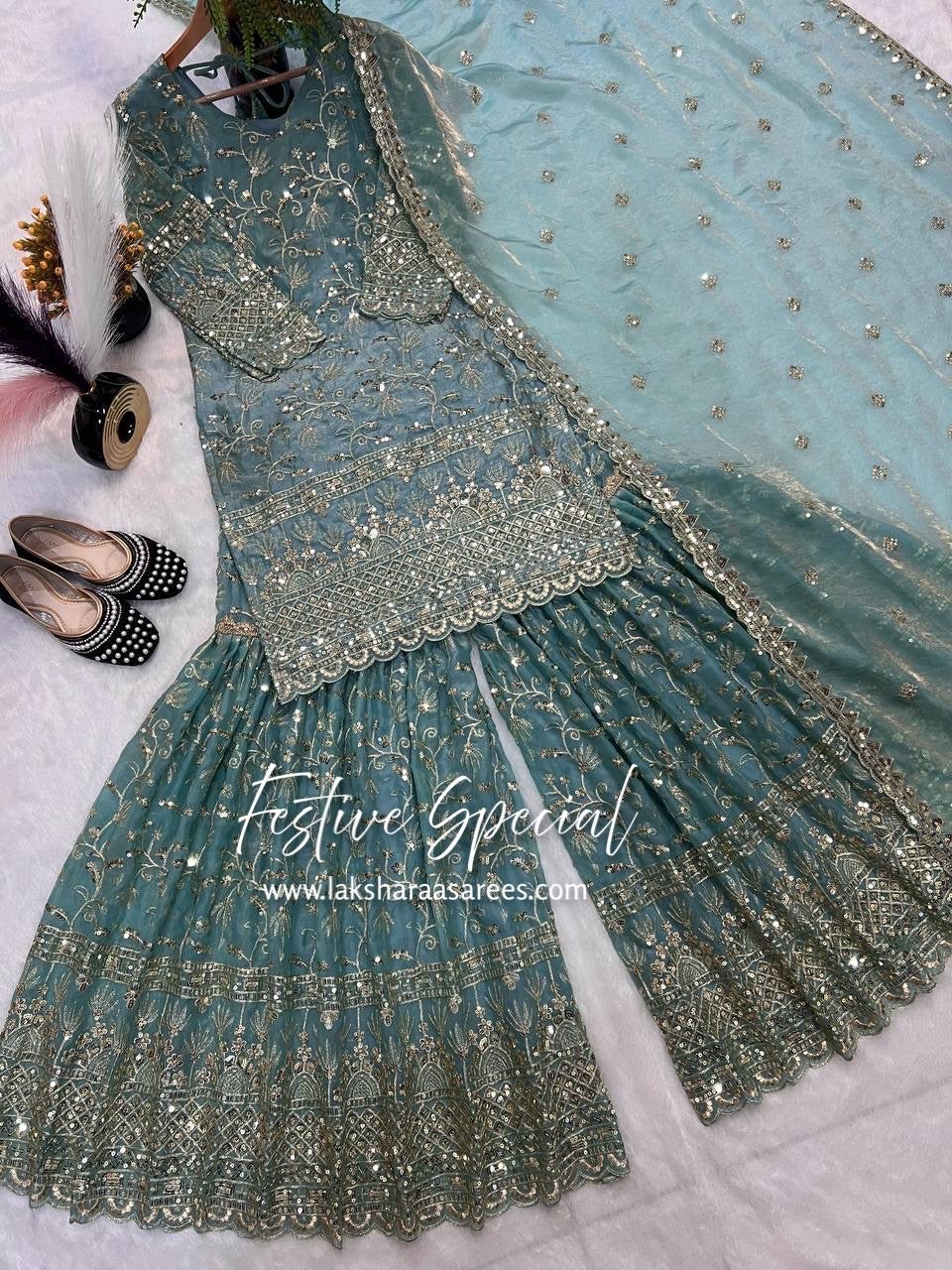 Elegant grand premium shararas by Laksharaa Sarees with intricate embroidery and vibrant fabric, perfect for festive occasions.
