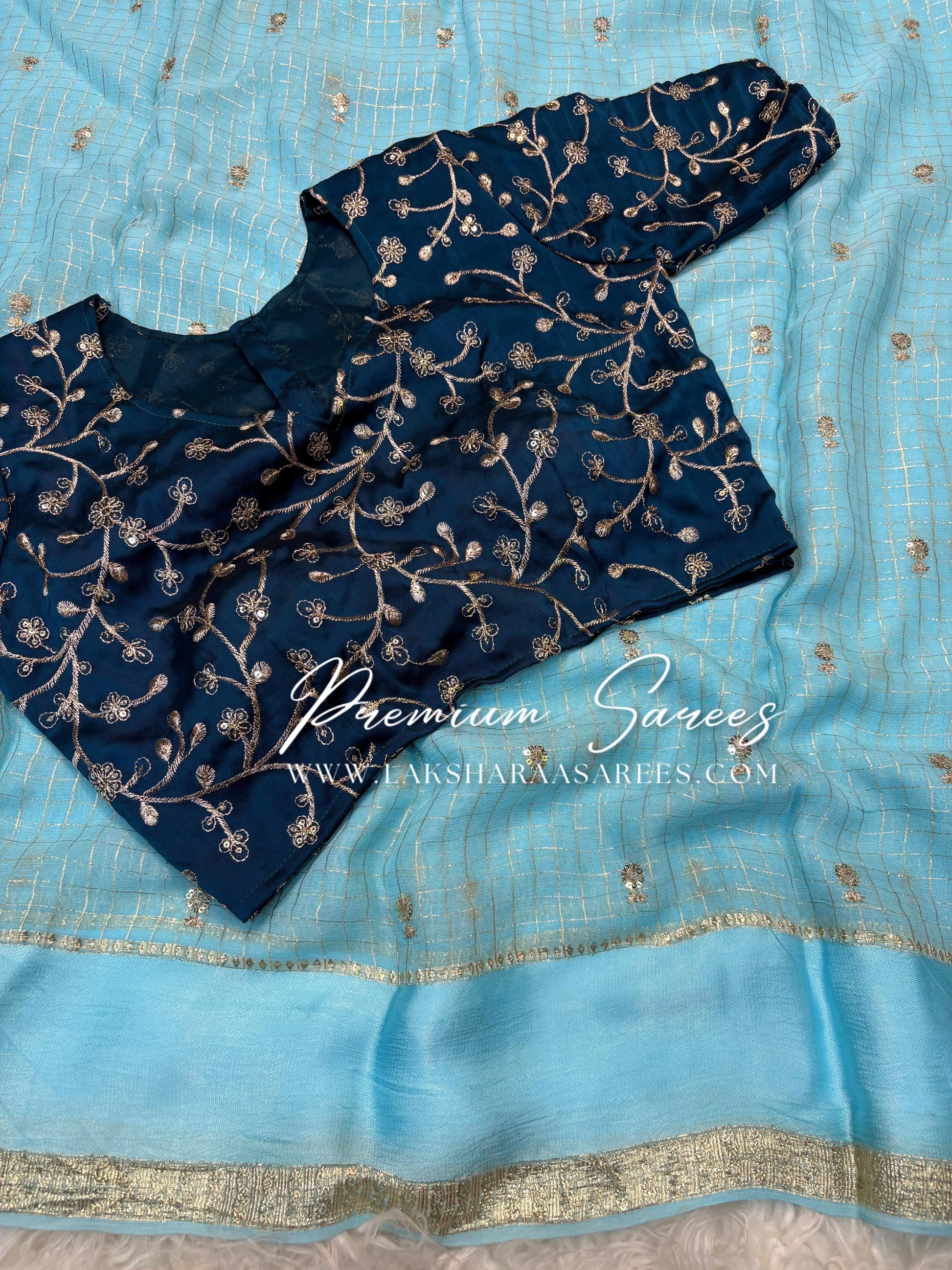 VANI Laksharaa Sarees Chex Viscose Georgette Saree with embroidered blouse, draped in traditional Indian attire, detailed fabric and craftsmanship