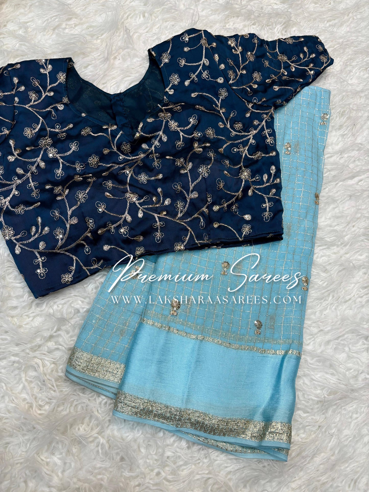 VANI Chex Viscose Georgette Saree with embroidered blouse, featuring intricate embroidery and traditional design in vibrant colors.