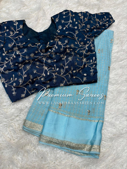 VANI Chex Viscose Georgette Saree with embroidered blouse, featuring intricate embroidery and traditional design in vibrant colors.