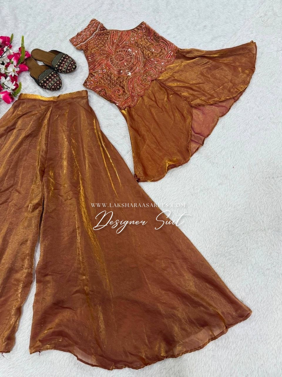 Shimmer silk halter top designer suit with intricate embroidery and matching palazzo pants, by Laksharaa Sarees.