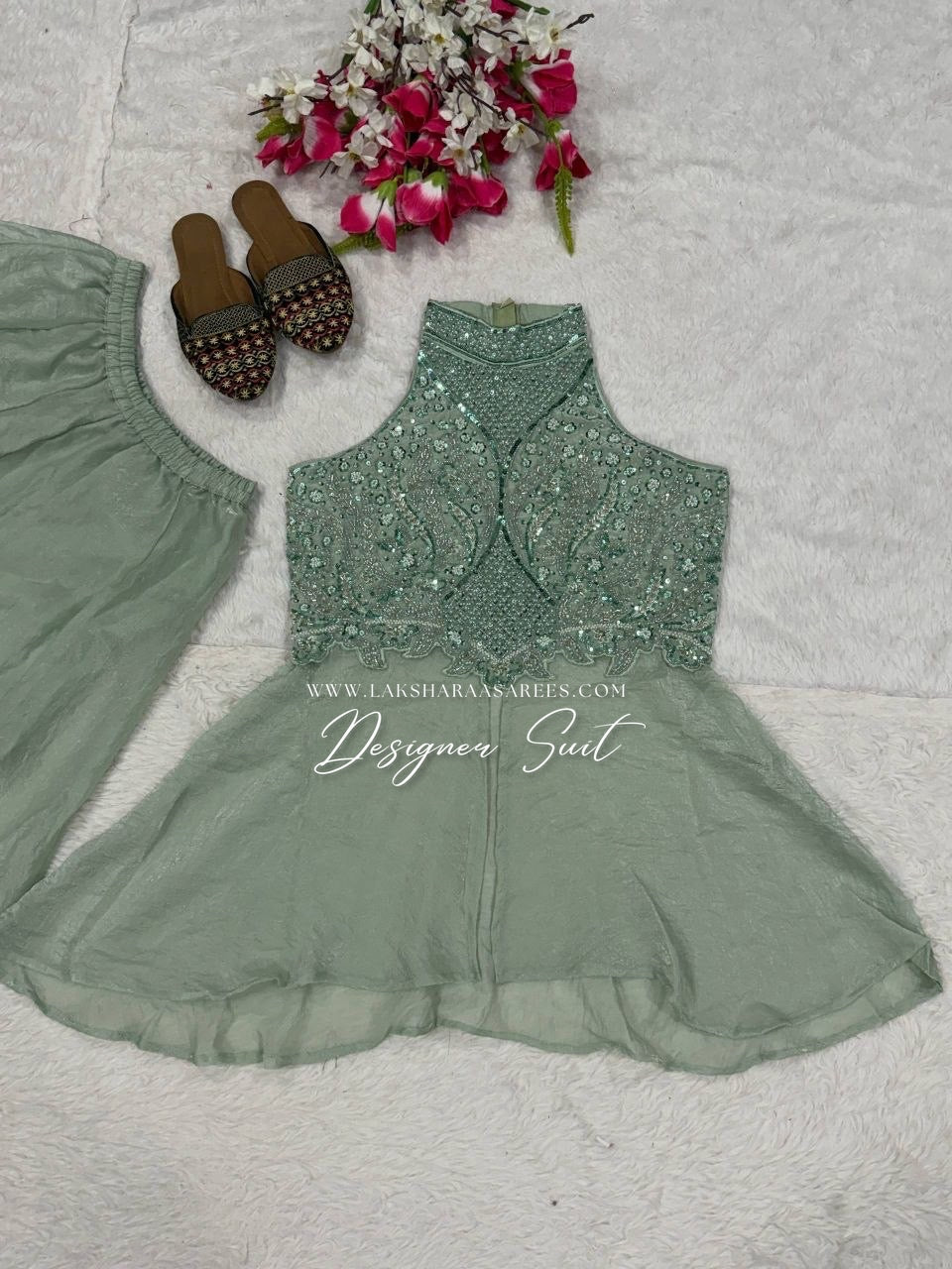 Shimmer silk halter top designer suit with matching palazzo pants by Laksharaa Sarees, featuring elegant, intricate embroidery.