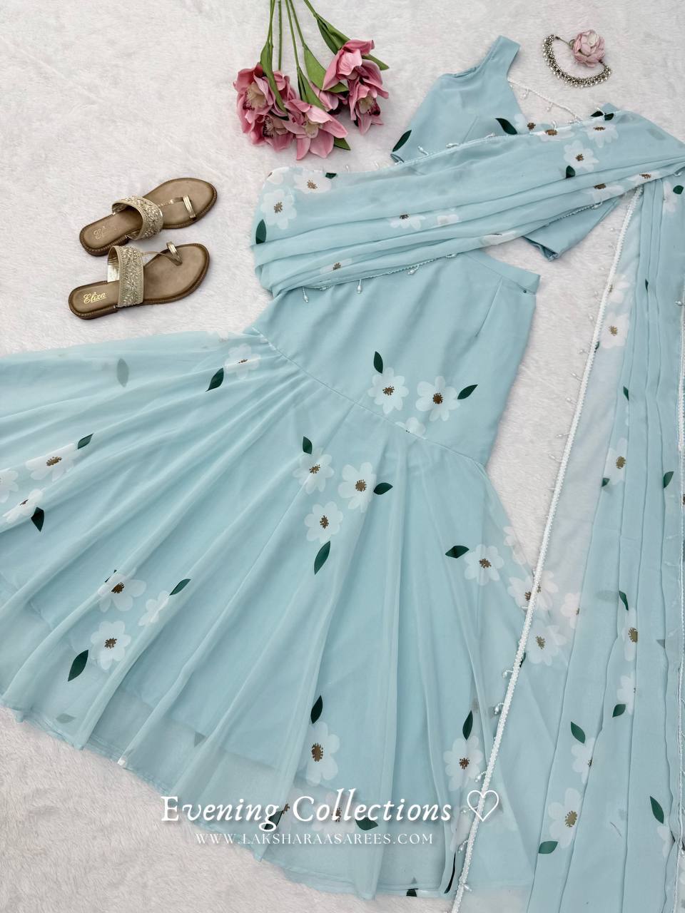 Laksharaa Sarees MAISY Aqua Lehenga Saree Set Flat Lay with Flowers and Sandals